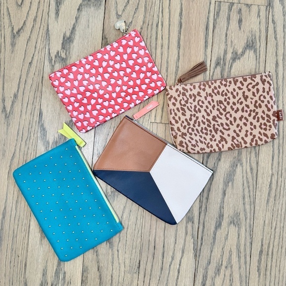 ipsy Handbags - IPSY Set of Four Stylish Studded Geometric Hearted Cheetah Pouches Never Used